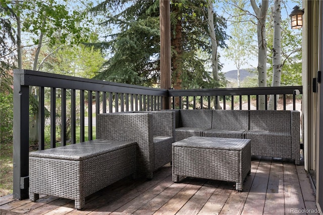 wooden deck featuring a mountain view