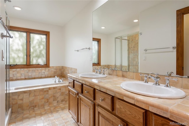 bathroom featuring vanity, separate shower and tub, and tile patterned floors