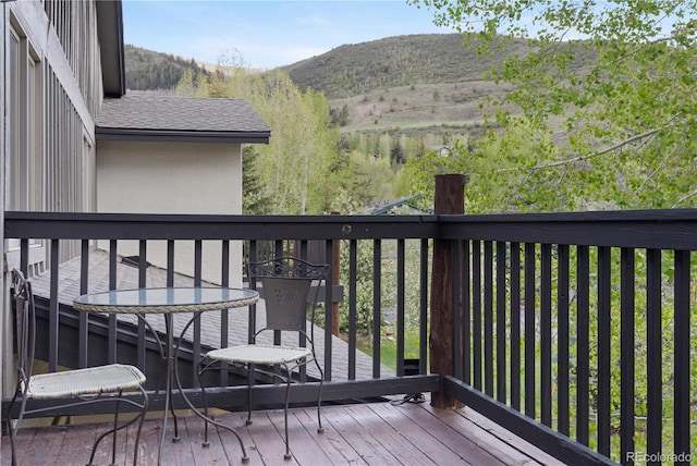 wooden deck featuring a mountain view