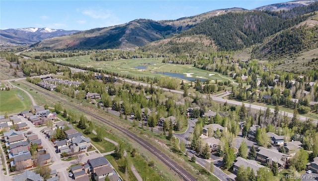 birds eye view of property featuring a water and mountain view