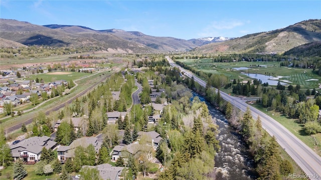 bird's eye view with a water and mountain view