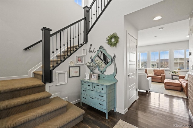 11046 Pastel Pt, Parker, CO 80134 - stairs featuring wood finished floors, baseboards, and recessed lighting