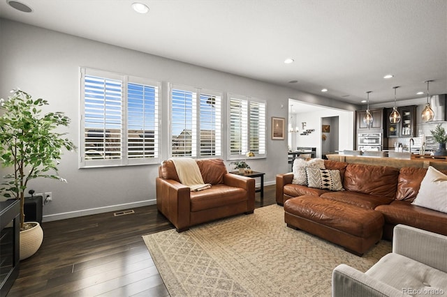 11046 Pastel Pt, Parker, CO 80134 - living room with baseboards, dark wood-type flooring, and recessed lighting