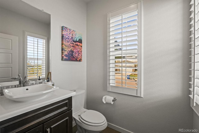 11046 Pastel Pt, Parker, CO 80134 - half bath with toilet, baseboards, and vanity