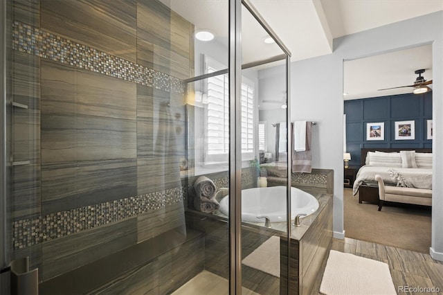 11046 Pastel Pt, Parker, CO 80134 - full bathroom with ensuite bath, ceiling fan, a shower stall, and a garden tub