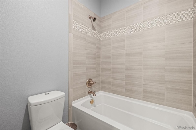 11046 Pastel Pt, Parker, CO 80134 - bathroom featuring shower / tub combination, toilet, and a textured wall