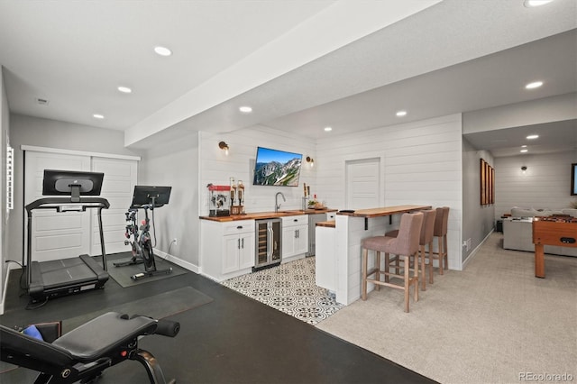 11046 Pastel Pt, Parker, CO 80134 - exercise room with wine cooler, bar with sink, recessed lighting, and baseboards