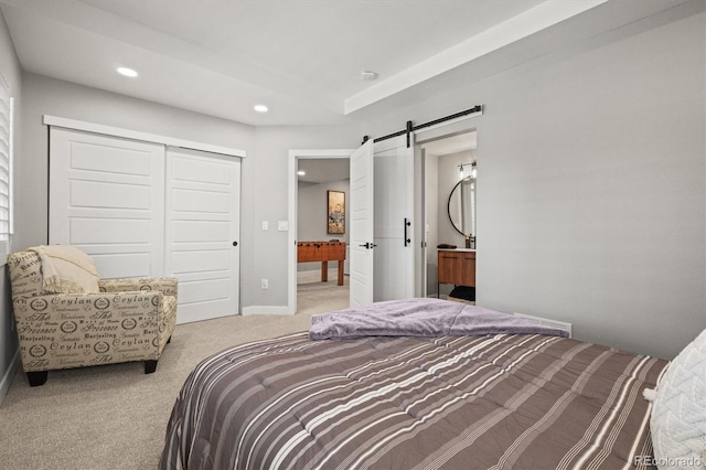 11046 Pastel Pt, Parker, CO 80134 - carpeted bedroom with a barn door, a closet, recessed lighting, and baseboards