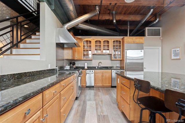 1515 N Ogden St Unit 7, Denver, CO 80218 - kitchen featuring visible vents, glass insert cabinets, light wood-style floors, a sink, and stainless steel appliances