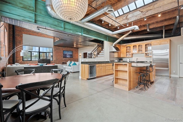 1515 N Ogden St Unit 7, Denver, CO 80218 - kitchen featuring open shelves, wine cooler, light brown cabinets, glass insert cabinets, and stainless steel built in fridge