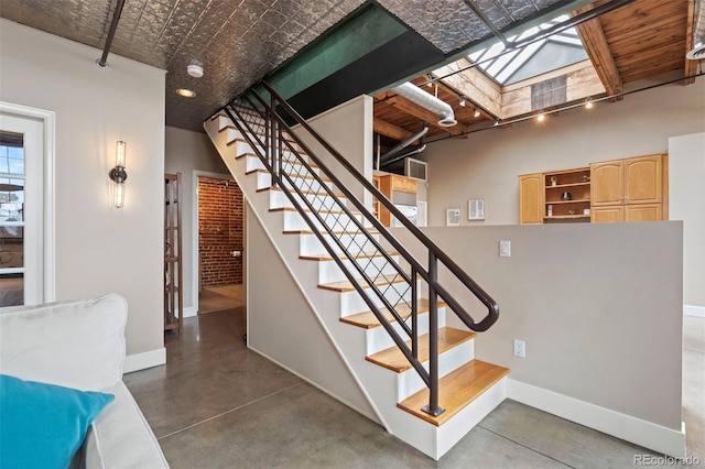 1515 N Ogden St Unit 7, Denver, CO 80218 - stairway with a skylight, baseboards, and concrete flooring