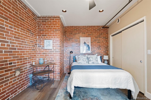1515 N Ogden St Unit 7, Denver, CO 80218 - bedroom featuring a closet, wood finished floors, brick wall, recessed lighting, and a ceiling fan