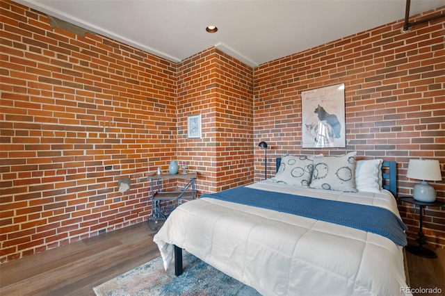 1515 N Ogden St Unit 7, Denver, CO 80218 - bedroom featuring recessed lighting, wood finished floors, and brick wall