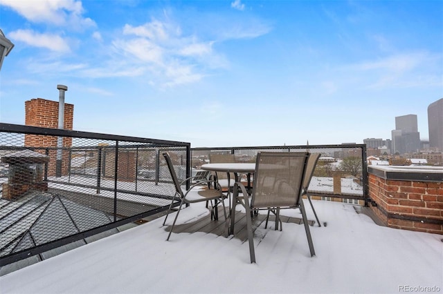 1515 N Ogden St Unit 7, Denver, CO 80218 - snow covered patio featuring a view of city, outdoor dining area, and a balcony