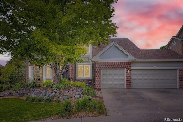 9962 Stratford Ln, Highlands Ranch, CO 80126 - view of front facade with brick siding, a garage, concrete driveway, roof with shingles, and a front yard