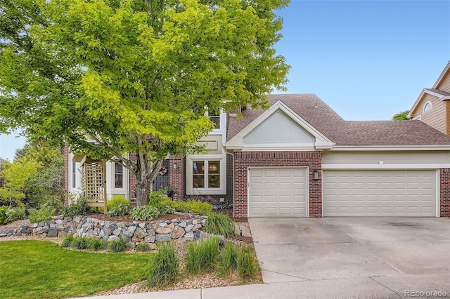 9962 Stratford Ln, Highlands Ranch, CO 80126 - view of front of property featuring brick siding, an attached garage, concrete driveway, and a shingled roof