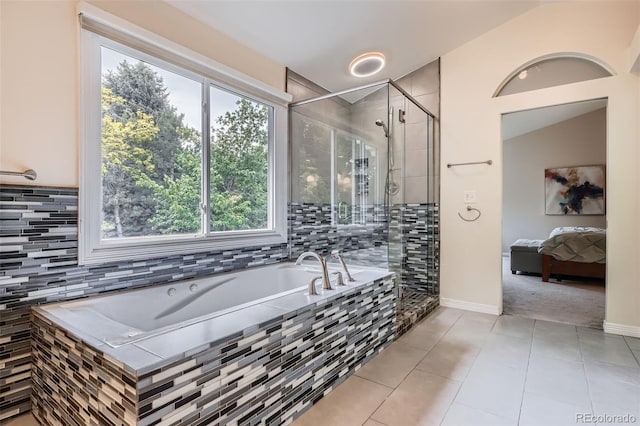 9962 Stratford Ln, Highlands Ranch, CO 80126 - full bath with a garden tub, plenty of natural light, tile patterned flooring, and a stall shower