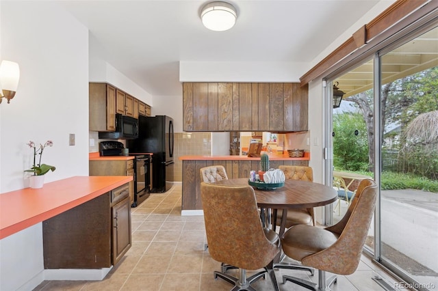 8484 E Radcliff Ave, Denver, CO 80237 - dining room with light tile patterned floors