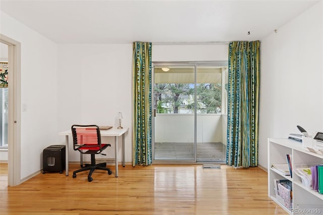 8484 E Radcliff Ave, Denver, CO 80237 - office area featuring wood finished floors and baseboards