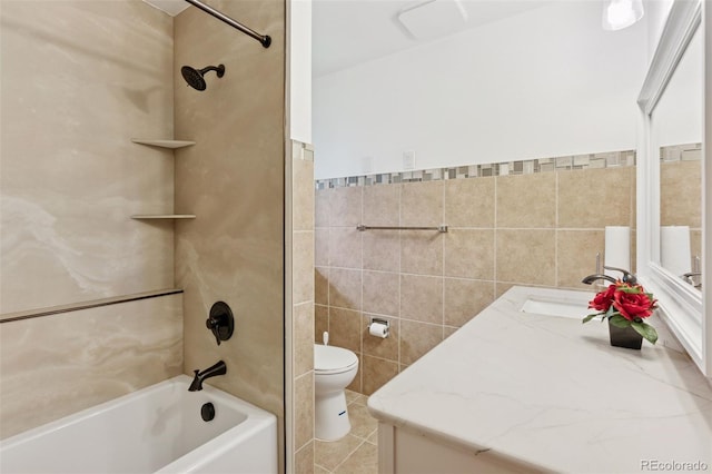 8484 E Radcliff Ave, Denver, CO 80237 - bathroom featuring tile walls, shower / tub combination, toilet, vanity, and tile patterned floors