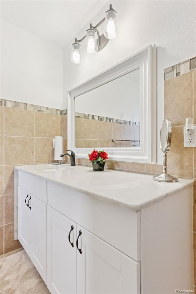 8484 E Radcliff Ave, Denver, CO 80237 - bathroom with a sink and tile walls