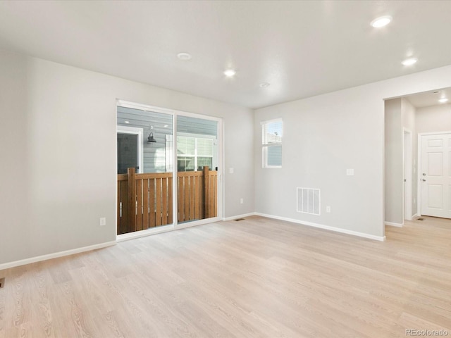 empty room with light hardwood / wood-style floors