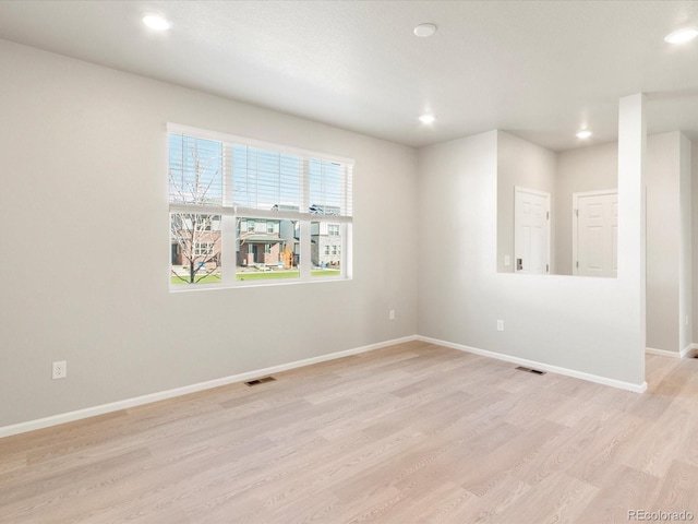 spare room with light wood-type flooring