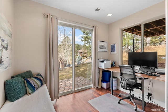 home office featuring recessed lighting, visible vents, and wood finished floors