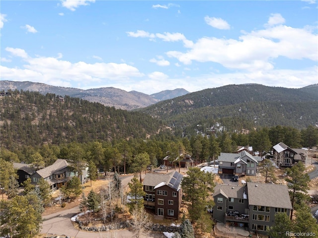 view of mountain feature featuring a residential view and a view of trees