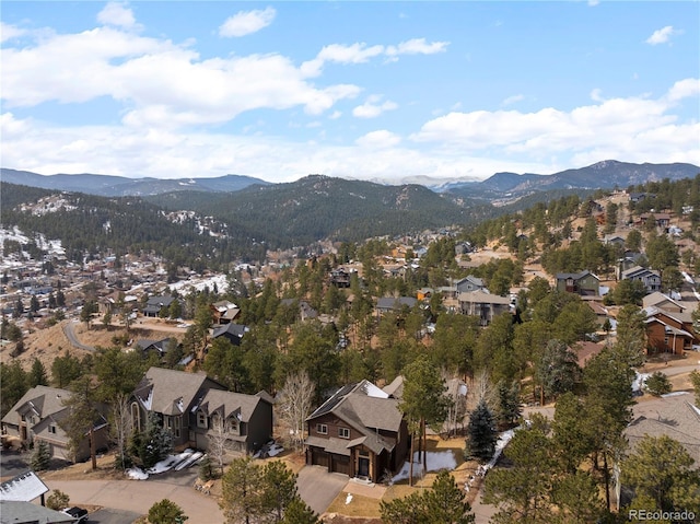 drone / aerial view featuring a residential view and a mountain view