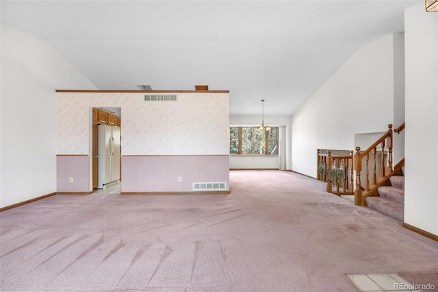 unfurnished living room with light carpet, baseboards, and visible vents