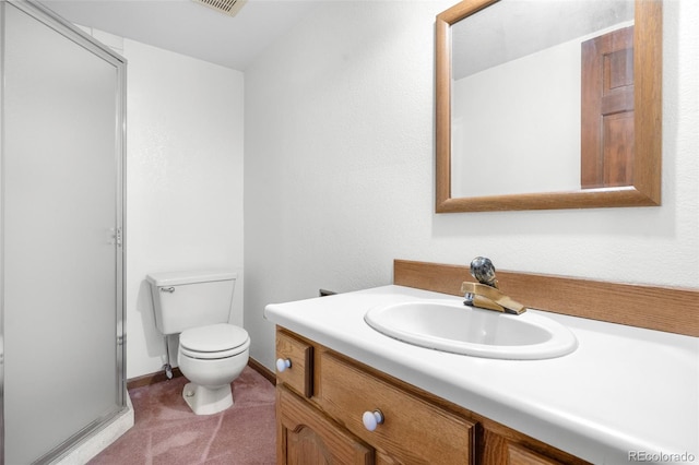 bathroom with toilet, visible vents, and vanity
