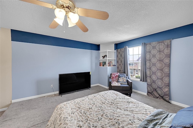bedroom with baseboards, a textured ceiling, carpet, and ceiling fan