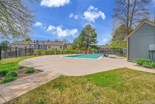 view of pool with a fenced in pool, fence, and a yard
