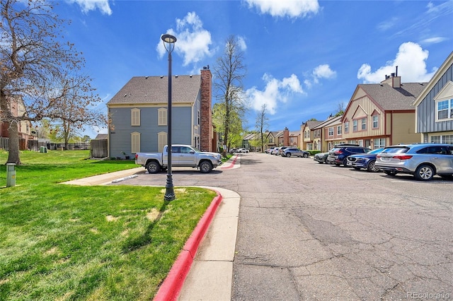 view of road with curbs and a residential view