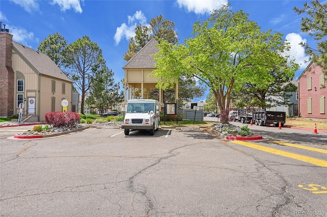 uncovered parking lot with a residential view