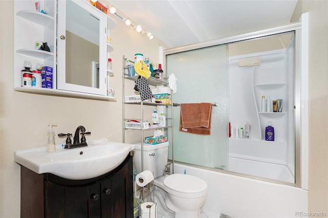 full bathroom with combined bath / shower with glass door, vanity, and toilet