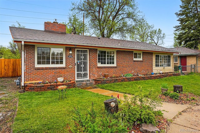 8736 W 46th Ave, Wheat Ridge, CO 80033 - ranch-style house with brick siding and a chimney