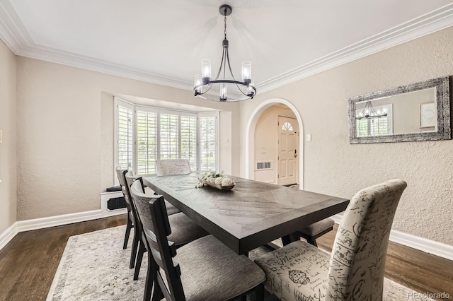 1000 N Monaco Pkwy, Denver, CO 80220 - dining area with arched walkways, a chandelier, a textured wall, baseboards, and dark wood finished floors