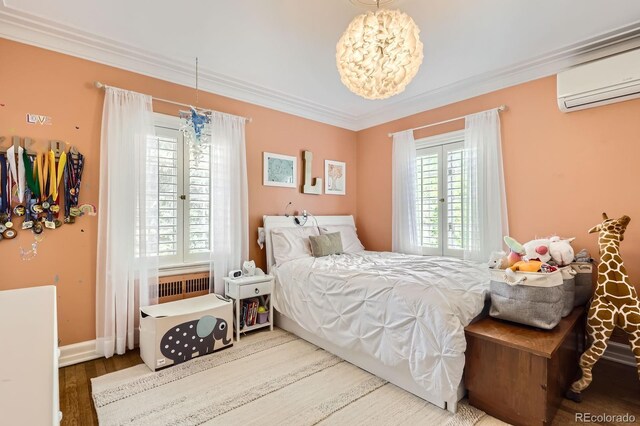1000 N Monaco Pkwy, Denver, CO 80220 - bedroom with a wall unit AC, ornamental molding, wood finished floors, a chandelier, and baseboards