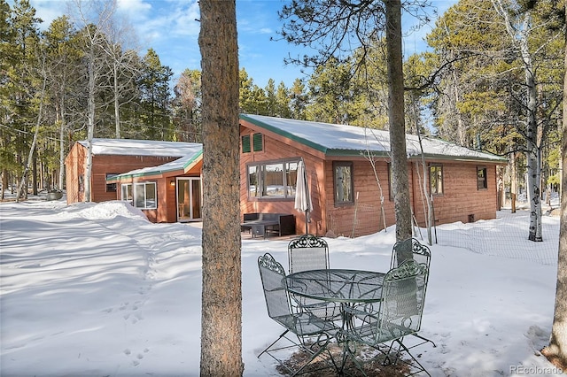 view of snow covered house