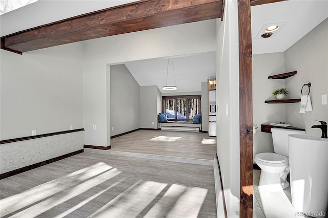 interior space with light hardwood / wood-style floors and baseboard heating