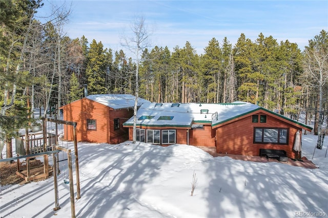 view of snow covered property