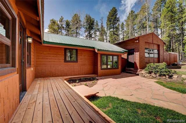 9123 Booker Ln, Conifer, CO 80433 - exterior space with a patio and metal roof