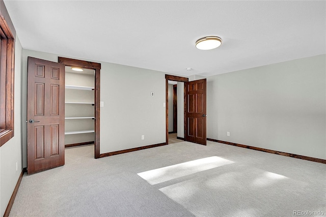 9123 Booker Ln, Conifer, CO 80433 - unfurnished bedroom featuring carpet flooring, baseboards, a spacious closet, and a closet
