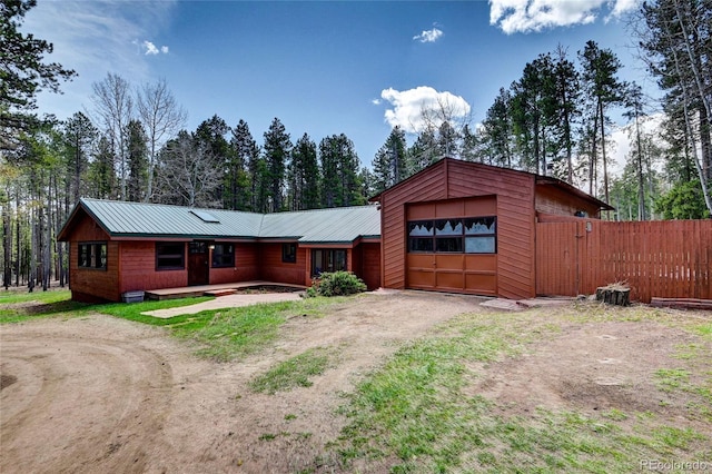 9123 Booker Ln, Conifer, CO 80433 - single story home with a garage, fence, driveway, and metal roof