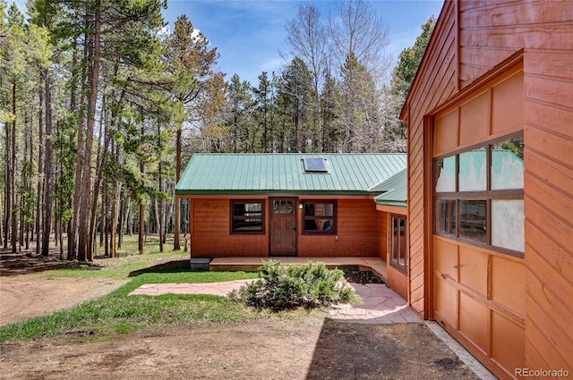 9123 Booker Ln, Conifer, CO 80433 - rustic home featuring metal roof