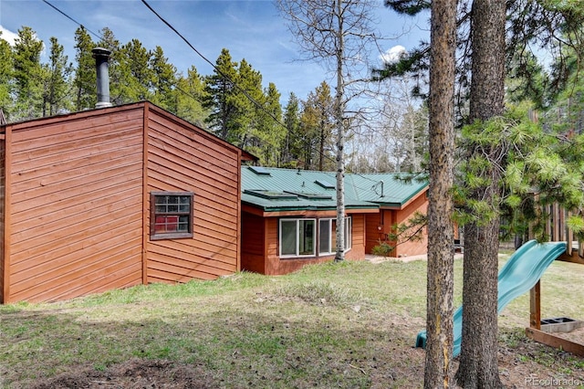 9123 Booker Ln, Conifer, CO 80433 - back of property featuring a yard and metal roof