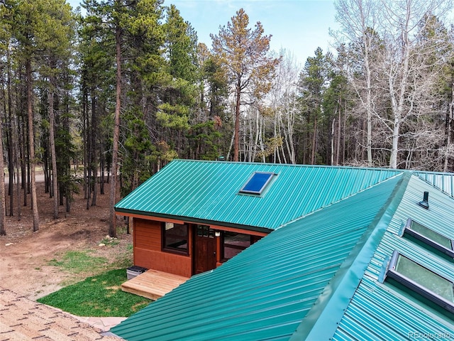 9123 Booker Ln, Conifer, CO 80433 - view of outbuilding featuring a view of trees