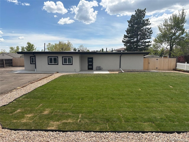 9950 W 17th Ave, Lakewood, CO 80215 - back of house with a patio and stucco siding